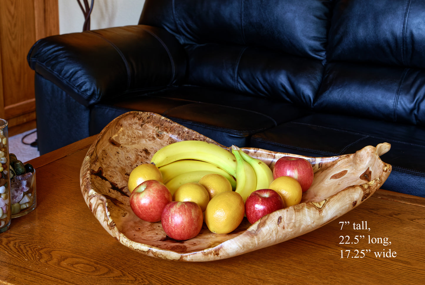 Fancy and irregular 22.5” long maple platter-like bowl sculpted from spalted maple. It has twisted and figured burl patterns, bird's-eye patterns, and rich colors of tan, brown, and gold with a hint of red, 215-A