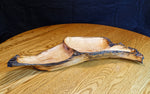 Front view of a 2-part wooden Ponderosa pine bowl, platter, charcuterie board.  Rustic yet smooth, with live edge.  It is 26.5" long x 11.5 x 4'' tall, and weighs 4.1 lbs., wild elegance.