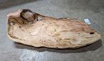 Art item almost ready for finish coating. Top and side view of a 34 inch long natural wood serving platter charcuterie board with a rustic, irregular shape and prominent grain. One-of-a-kind Ponderosa pine, live edge that is both smooth and rough features and beautiful grain patterns.  It measures 8.25 tall x 33.75 inches long x 13.5'', 7.8 lbs. 