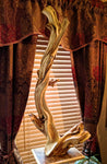 Juniper wood. Twisted free flowing one-of-a-kind floor or tabletop natural wood sculpture, with beautiful grain patterns.  It measures 43 tall x 22 x 14'', 13 lbs. 