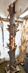 Raw wood with bark, standing in my shop and ready for carving. 
