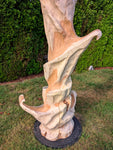 Close up of the sculptures colorful and shapely base. 
