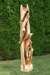 Possible left side view of a tall and twisted wood sculpture, rich looking one-of-a-kind 7' 3" tall by 22.5" x 22'' natural western juniper floor sculpture that emphasizes the tree's natural form and beauty.  It has some live edge design and is a combination of smooth surfaces with beautiful grain patterns and and a few slightly rough areas.  Some preserved insect holes show its past visitors.