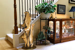 36.7" tall twisted floor sculpture displayed beside a stairwell and figurine display case. One-of-a-kind exotic,  It was created from Pacific Ocean driftwood.  It has beautiful and exotic grain patterns with rich natural golden orange, tan, brown, black and gray colors (no stains or artificial colors).  The art piece measures 36.7 x 14.5 x 12.25'', 21.87 lbs.    RC Paulson Wildwood Art