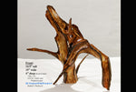 Irregular wooden sculpture on a white platform with text overlay.  Can be a vase. 