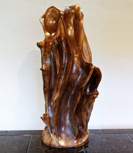Beautiful brown tabletop and floor wooden sculpture 31.5" tall created from black Walnut wood.  It has freeform flowing lines showing amazing wood grain. The wood was rescued from a 24 inch diameter tree that died and fell in an Oregon winter storm.